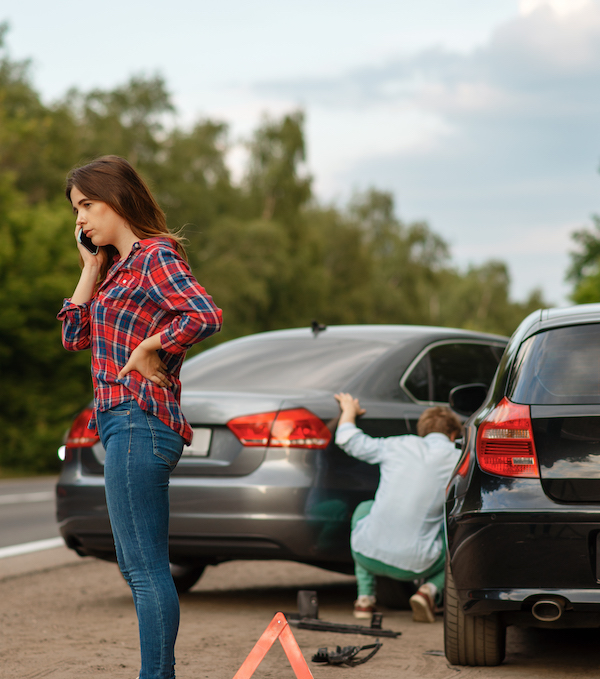 Male and female drivers on road, car accident. Automobile crash. Broken automobile or damaged vehicle, auto collision on highway